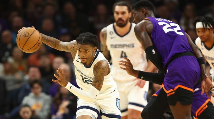 Dec 23, 2022; Phoenix, Arizona, USA; Memphis Grizzlies guard Ja Morant (12) against the Phoenix Suns in the first half at Footprint Center.